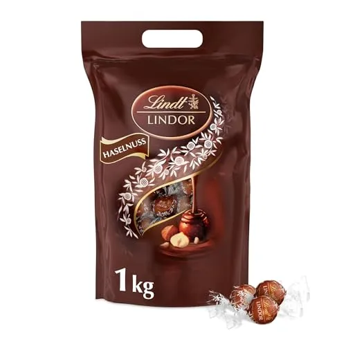 Lindt Lindor XXL Beutel Nuss Haselnuss Schokolade Pralinen - 1kg - Schokoladenbonbons & Pralinen, unwiderstehlicher Haselnussgeschmack in einem praktischen 1kg Beutel für genussvolle Momente.