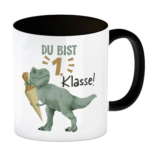 Dino mit Schultüte Kaffeebecher in schwarz mit Spruch Du bist 1. Klasse! zum Schulanfang Lustiger T-Rex Kaffeebecher in schwarz für Schulkinder zur Einschulung