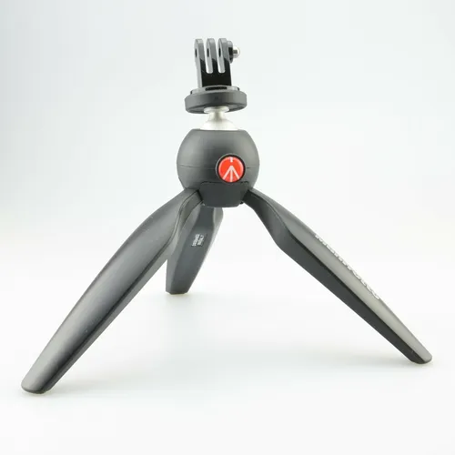 Manfrotto GoPro ® Tischstativ oder Handhalter - Faltbares Aluminium-Stativ für GoPro und Kameras, mit Schnellspanner und Gummifuß für stabilen Halt, ideal für kreative Aufnahmen.