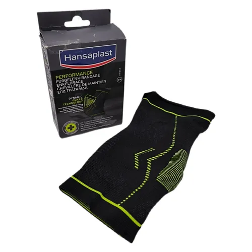 Hansaplast Sprunggelenkbandage Performance, schwarz, Größe S/M - Beidseitig tragbare Bandage zur Stabilisierung und Entlastung des Knöchels, ideal für Sport und Fitness. Flexibles Gewebe sorgt für hohen Tragekomfort und Beweglichkeit.