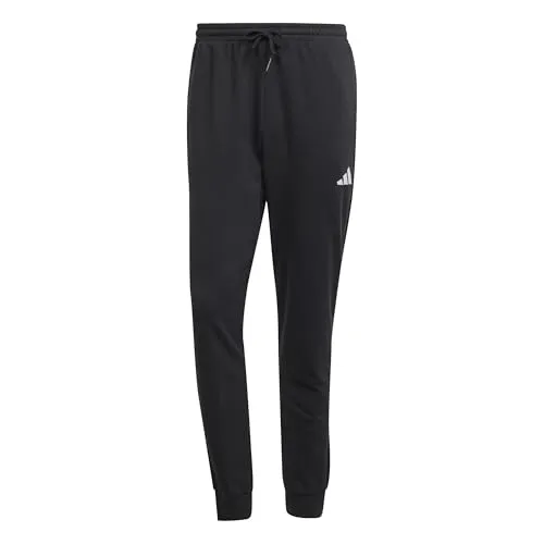 ADIDAS Herren Hose Essentials Feel Cozy French Terry - Modische Hose aus weichem French Terry für maximalen Komfort, ideal für entspannte Tage. Hergestellt aus mindestens 70% recycelten und erneuerbaren Materialien.