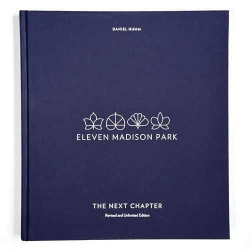 Eleven Madison Park: The Next Chapter, Revised and Unlimited Edition - Kochbuch für Feinschmecker, bietet kreative Rezepte und innovative Techniken von einem der besten Restaurants der Welt.