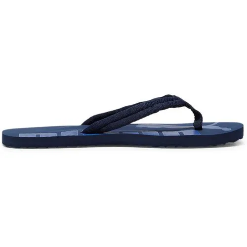 PUMA Herren Flip Flops Epic Flip v2 - Badeschuhe für den Sommer, leicht und kompakt, ideal für Strand und Freizeit. Entdecke hochwertige Sportartikel für aktive Lebensstile im INTERSPORT Online Shop.
