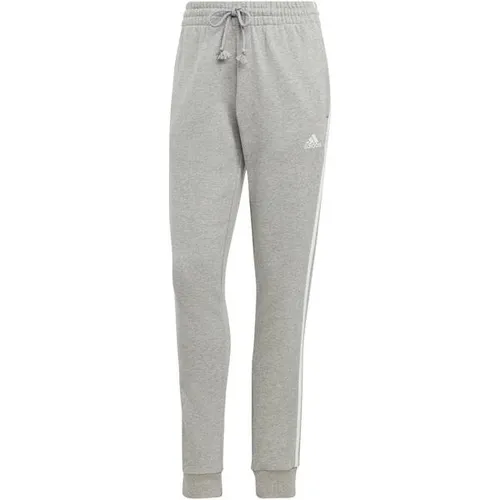 ADIDAS Damen Hose Essentials 3-Streifen French Terry Cuffed - Modische Hosen für sportliche Aktivitäten, aus bequemen French Terry für optimalen Tragekomfort und mit schmalem Schnitt für einen stylischen Look.