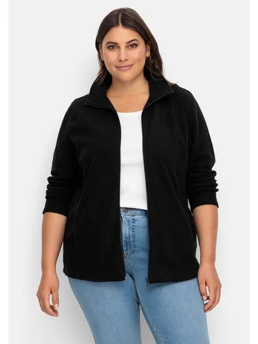 Sheego Strickjacke mit Reißverschluss in Schwarz für Große Größen - Cardigan für Große Größen, figurumspielender Schnitt und praktischer Reißverschluss für einen lässigen Look.