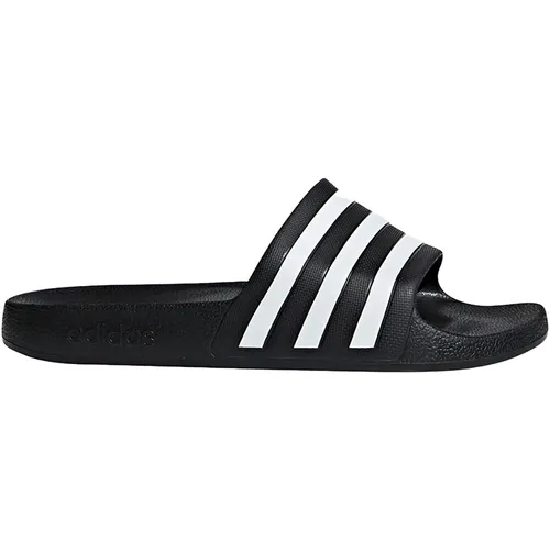 Adidas Adilette Aqua - schwarz - Stylische Adilette für das Schwimmbad. Mit minimalistischen Design und 3-Streifen-Logo. Die weiche Dämpfung sorgt für hohen Tragekomfort, ideal für müde Füße nach dem Workout.