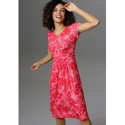 Sommerkleid mit Palmen und Blüten in Knallfarbe, Gr. 34 - Modisches Sommerkleid in pink-rot mit Palmen- und Blumenmuster, figurbetont und knieumspielend, ideal für einen stylishen Sommerlook.
