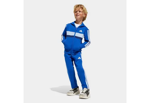 ADIDAS SPORTSWEAR LK 3S TIB FL TS Trainingsanzug für Kinder - Sportliche Trainingsbekleidung aus 70% Baumwolle, ideal für Komfort und Style beim Spielen oder Entspannen. Hergestellt aus recycelten Materialien, umweltfreundlich und bequem.