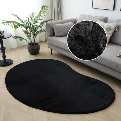 Fellteppich OTTO HOME "Balu Bean, Kaninchenfell" - U-förmiger Teppich in Schwarz - Gestalte dein Zuhause stilvoll mit dem U-förmigen Fellteppich "Balu Bean" von OTTO HOME. Strapazierfähig und pflegeleicht, sorgt er für eine gemütliche Atmosphäre in jedem Raum.