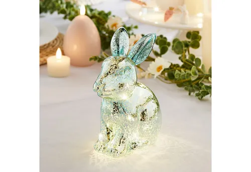Lights4fun LED Osterhase aus Glas – Moderne Osterdeko - Der 15 cm große LED Dekohase bringt mit 6 warmweißen LEDs und schimmerndem Effekt festliche Stimmung in Ihr Zuhause. Ideal für Kommode oder Esstisch, mit praktischer Timerfunktion für abendliches Leuchten.
