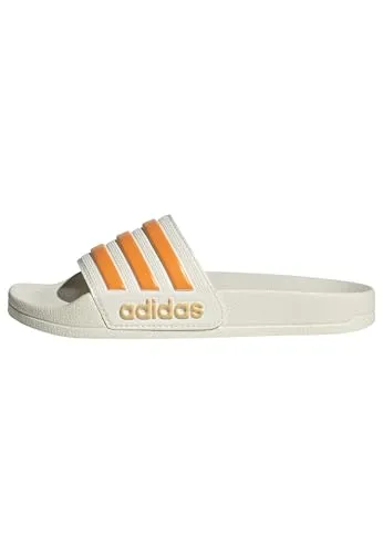 adidas Adilette Shower Badelatschen Kinder in owhite-puta-seicta, Größe 28 - Stylische Badelatschen im Colourblock-Design mit breitem Riemen aus Synthetik und weichem CloudFoam-Fußbett. Ideal für den Schwimmbadbesuch oder entspannte Tage zu Hause.
