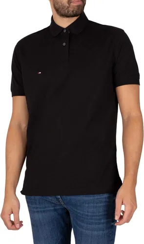 Tommy Hilfiger Herren Poloshirt Kurzarm 1985 Regular Fit, Schwarz (Black), XL - Poloshirt für Herren aus 96% Bio-Baumwolle, bietet hohen Tragekomfort und optimale Passform. Der klassische Kragen und die dezente Flag verleihen einen eleganten Look für smarte Casual-Outfits.