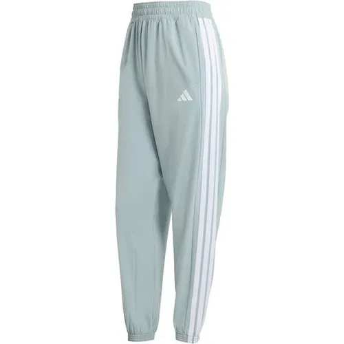 ADIDAS Damen Sporthose Train Essentials 3-Streifen Woven - Vielseitige Trainingshose von adidas mit schmal zulaufender Beinform für eine moderne Silhouette. Das leichte Material sorgt für hohen Tragekomfort und effektives Feuchtigkeitsmanagement – ideal für dein Workout.