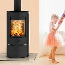 Fireplace Elite Angerona Kaminofen Stahl Schwarz mit Glasabdeckplatte - Kaminofen für kleine Räume bis 90 m³ mit 5 kW Nennleistung, automatischem Türverschluss und Anschluss für externe Zuluft für maximale Sicherheit und Effizienz.