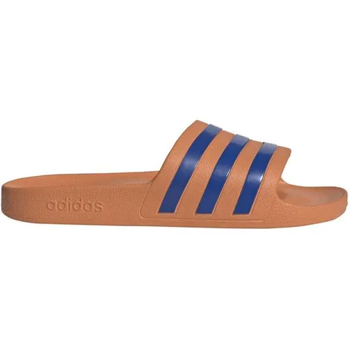 Adidas Unisex Adilette Aqua Badeschuh - 46 - dusty orange / team royal blue - Ideal für Schwimmbad und Entspannung nach dem Sport! Die minimalistische Adilette mit 3-Streifen bietet weiche Dämpfung für höchsten Komfort und lässigen adidas Style.
