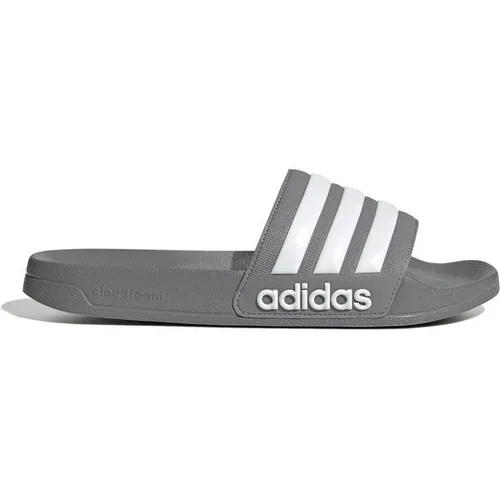 ADIDAS Herren Badeslipper Shower adilette - Ideal für Schwimmbad, Umkleide oder Zuhause – die adilette bietet hohen Komfort und ein sportliches Design mit adidas Logo. Leicht und dämpfend für angenehmes Tragegefühl.