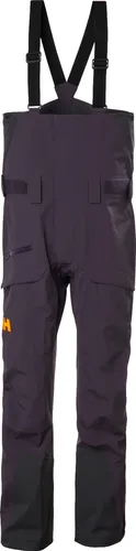 Helly Hansen Sogn Bib Shell Pant - Hochwertige Latzhose für Herren - Die Sogn Bib Shell Pant von Helly Hansen vereint Wasserdichtigkeit, Atmungsaktivität und Robustheit für leidenschaftliche Freeskier. Mit verstellbaren Hosenträgern und praktischen Cargotaschen bietet sie optimalen Komfort und Stauraum.