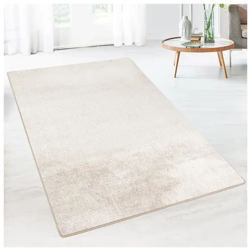 Karat Teppich Sundae Creme 20 - Individuell maßgefertigter Velours-Teppich "Sundae" in Creme - ideal für stilvolles Wohnen. Genießen Sie höchsten Komfort und ein flauschiges Gefühl unter den Füßen.