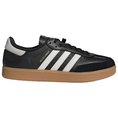 adidas Unisex Velosamba Fahrradschuh aus Leder in Core Black/Cloud White/Gold Metallic - Hochwertiger Fahrradschuh mit regulärer Passform und robustem Full-Grain-Leder. Ideal für sportliche Aktivitäten und bietet optimalen Halt durch die spezielle Zwischensohle.
