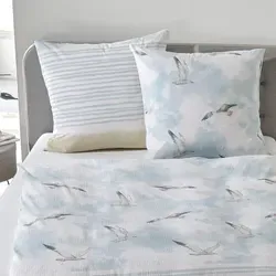 Traumschlaf Seersucker Bettwäsche Möwen 160x210 cm – Blau-Beige - Frische Seersucker Bettwäsche mit Möwen-Motiv für ein maritimes Ambiente. Pflegeleicht und atmungsaktiv, ideal für warme Nächte. Genießen Sie angenehmen Schlafkomfort ohne Bügeln!