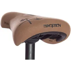 Demolition Axes Embossed Sattel - Golden - Hochwertiger Fahrradsattel mit geprägtem Logo, ideal für Komfort und Stil. Erhältlich in Schwarz oder Braun, perfekt für den täglichen Einsatz.