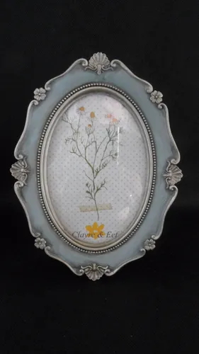 Clayre & Eef Bilderrahmen Hellblau 15x20 cm - Eleganter Bilderrahmen aus Polyresin mit Glasfront, detailreich gestaltet und ideal für besondere Erinnerungen.