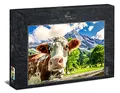 Ulmer Puzzleschmiede - Puzzle „Traum-Kuh-Lisse“ - 2000 Teile Alpen-Puzzle – die neugierige Kuh in Nahaufnahme als Fotopuzzle vor Traumhafter Berg-Kulisse im Alpenraum