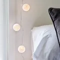 Lights4fun Lichterkette mit 10 hellen Baumwollkugeln und warmweißen LEDs für den Innenbereich