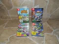 4x Nintendo Switch Spiele - Animal Crossing + Super Heroes 2 + Splatoon 2 + 3