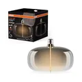 Osram Vintage 1906 Big Elipse ist eine dimmbare LED-Lampe mit Filament in Ellipsenform. Sie bietet 4 W für 60 lm, E27 Fassung, Smoke Design, 215 mm Durchmesser, Farbwiedergabe CRI 80, 1800 K.