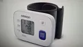 SW-0683 OMRON RS1 digitales Blutdruckmessgerät Handgelenk weiß unisex B-WARE