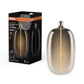 Osram Vintage 1906 Big Elipse Oval ist eine dimmbare LED-Lampe mit Filament in Ellipsenform. Sie bietet 4.8 W für 100 lm, E27 Fassung, Smoke Design, 145 mm Durchmesser, Farbwiedergabe CRI 80, 1800 K.