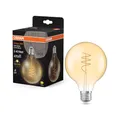 Osram Vintage 1906 Globe ist eine warmweiße LED-Lampe mit spiralförmigem Filament in klassischer Ballform. Sie bietet 3.4 W für 470 lm, E27 Fassung, goldfarbenes Glas, 95 mm Durchmesser, 2700 K.